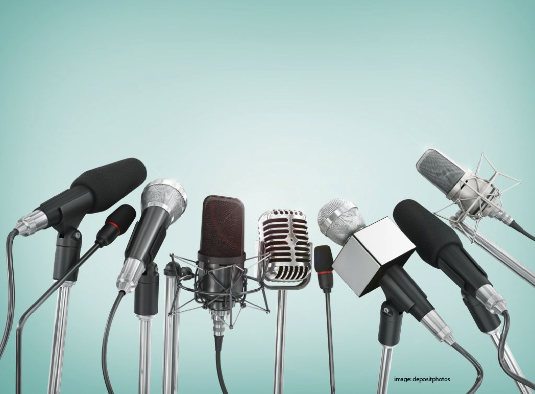 an image of microphones in a green background